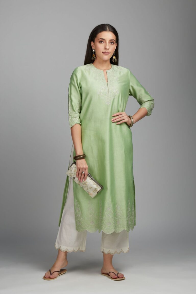 Lime green straight kurta set with silver zari embroidery at neck and scalloped hem