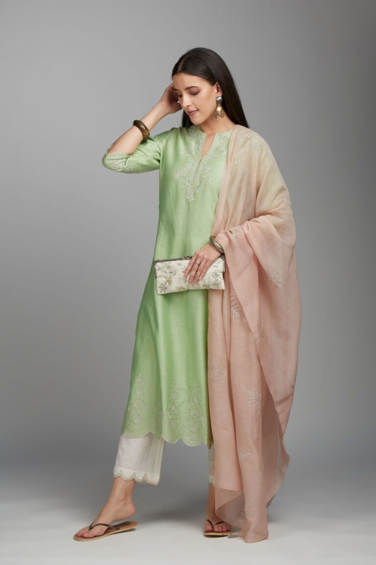 Lime green straight kurta set with silver zari embroidery at neck and scalloped hem
