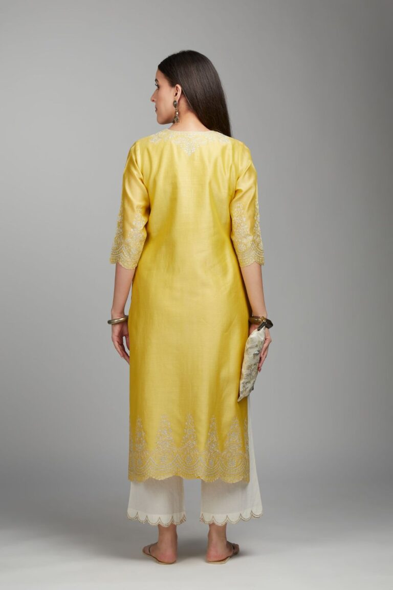 Yellow straight kurta set with silver zari embroidery at neck and scalloped hem