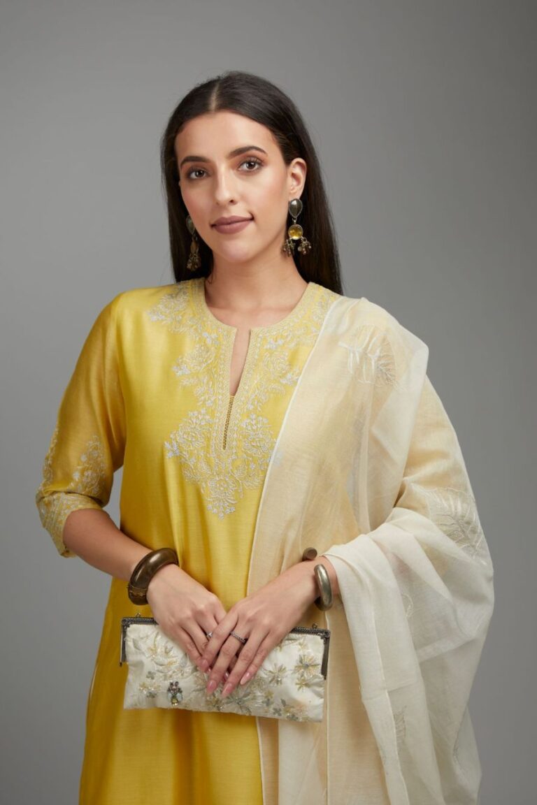 Yellow straight kurta set with silver zari embroidery at neck and scalloped hem