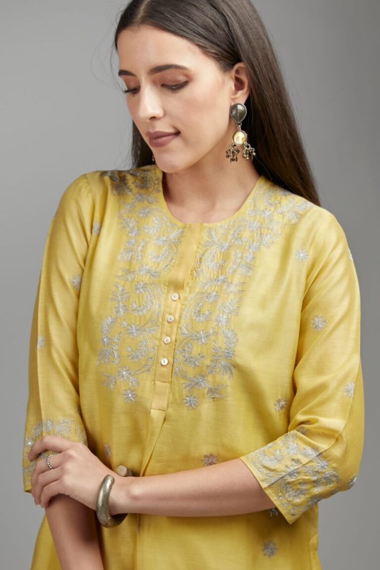 Yellow straight kurta set with silver zari embroidery and round neckline with button placket in the front