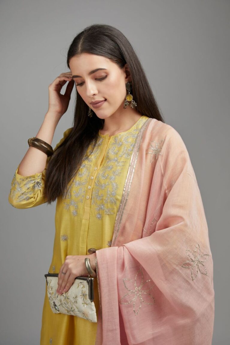 Yellow straight kurta set with silver zari embroidery and round neckline with button placket in the front