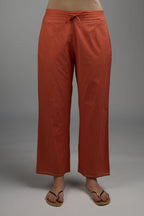 Rust straight cotton pants with single gota line detailing at hem