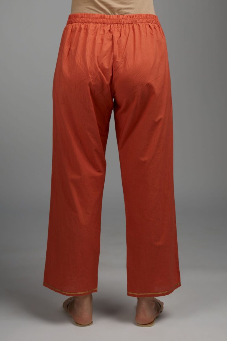 Rust straight cotton pants with single gota line detailing at hem
