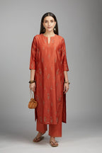 Rust straight kurta set with all-over dull gold zari embroidery