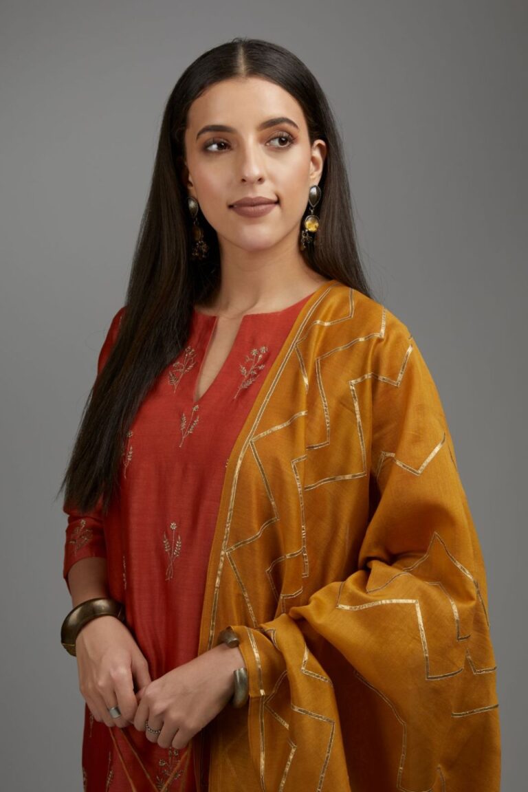 Rust straight kurta set with all-over dull gold zari embroidery