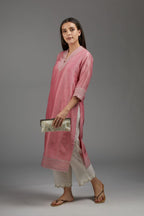 Pink straight kurta set with all-over silver zari embroidery and V neckline with one functional button in front