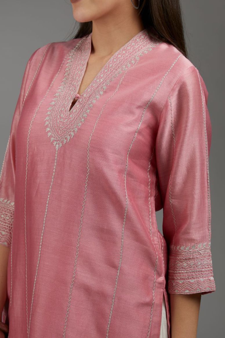 Pink straight kurta set with all-over silver zari embroidery and V neckline with one functional button in front