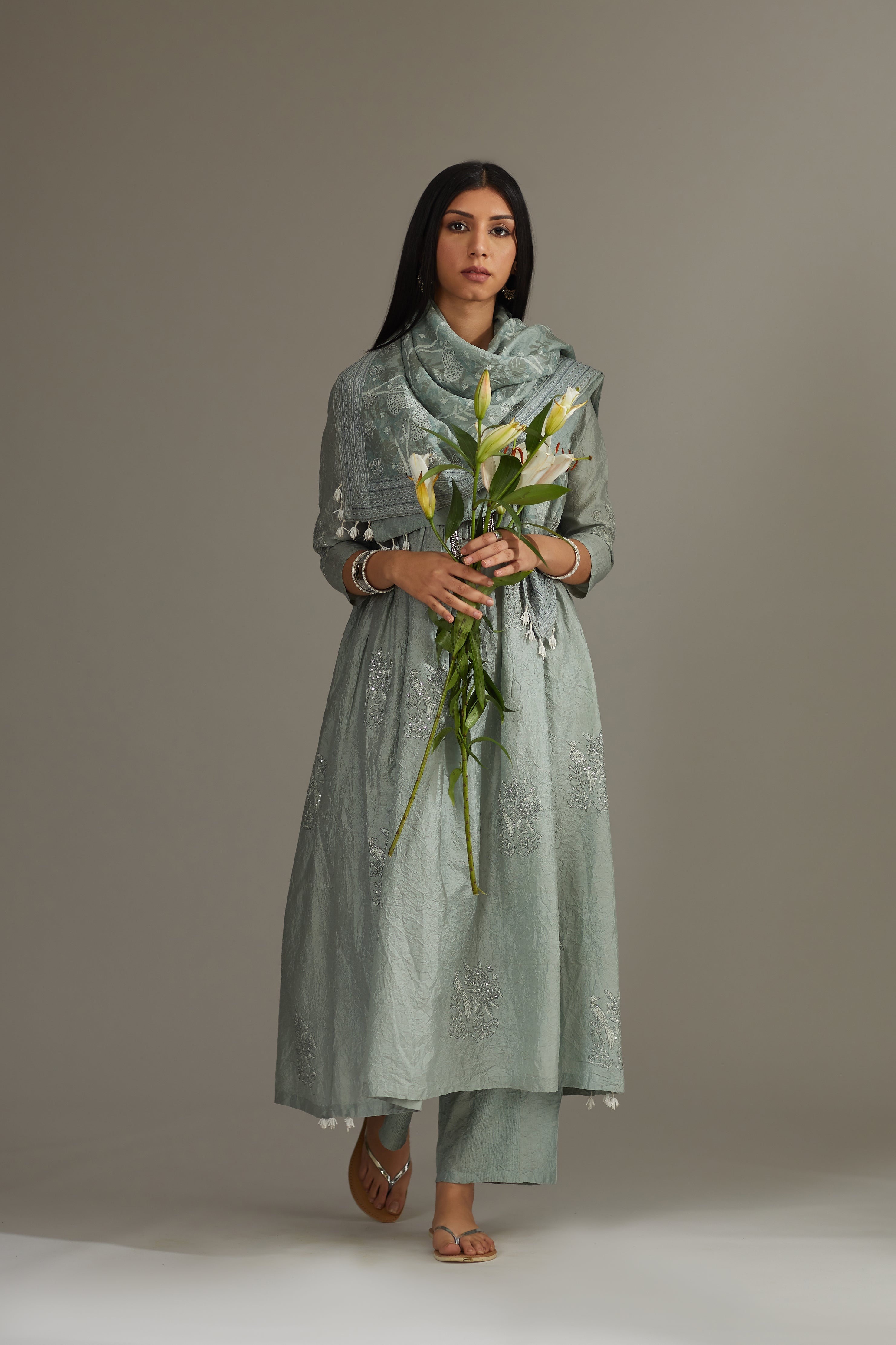 Sea blue hand-crushed silk kurta set with wavy empire waistline and gathers, highlighted with delicate sequins embroidery