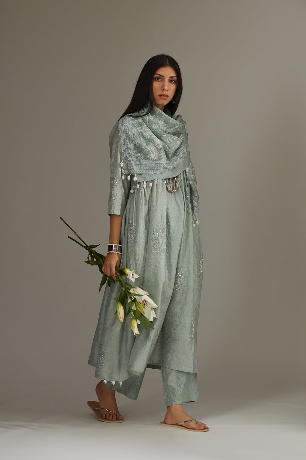 Sea blue hand-crushed silk kurta set with wavy empire waistline and gathers, highlighted with delicate sequins embroidery