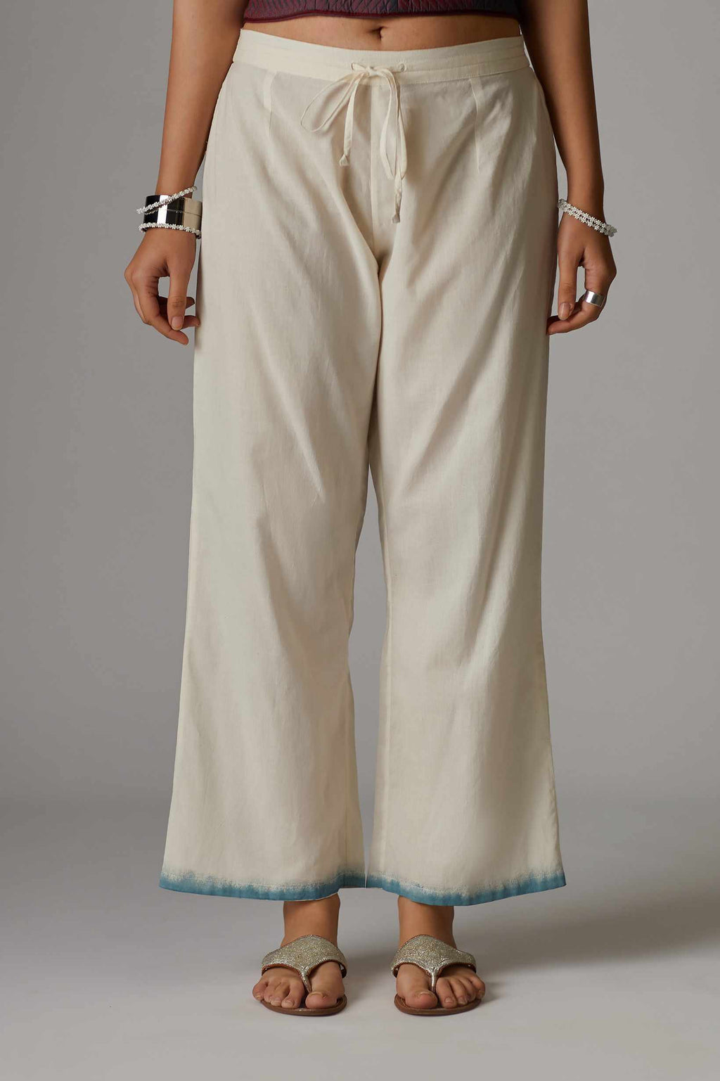 Off white straight pant with hand block print at the bottom