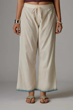 Off white straight pant with hand block print at the bottom