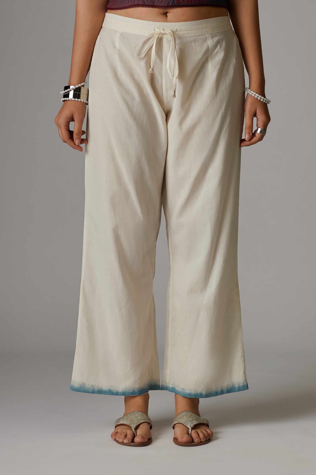 Off white straight pant with hand block print at the bottom