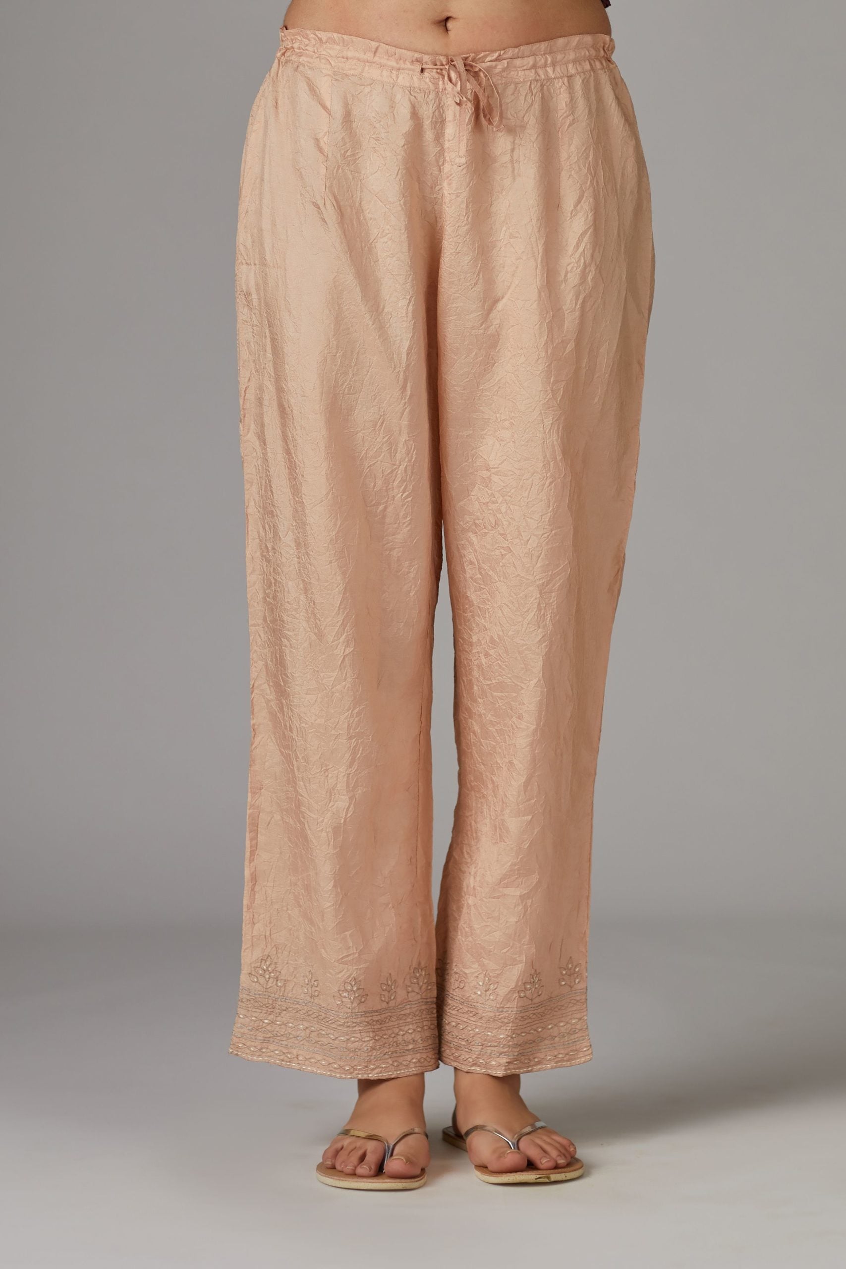 Peach straight pant with quilted embroidery at bottom hem