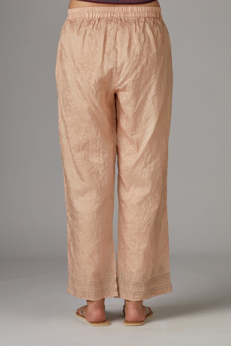 Peach straight pant with quilted embroidery at bottom hem