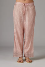 Pink straight pant with quilted embroidery at bottom hem