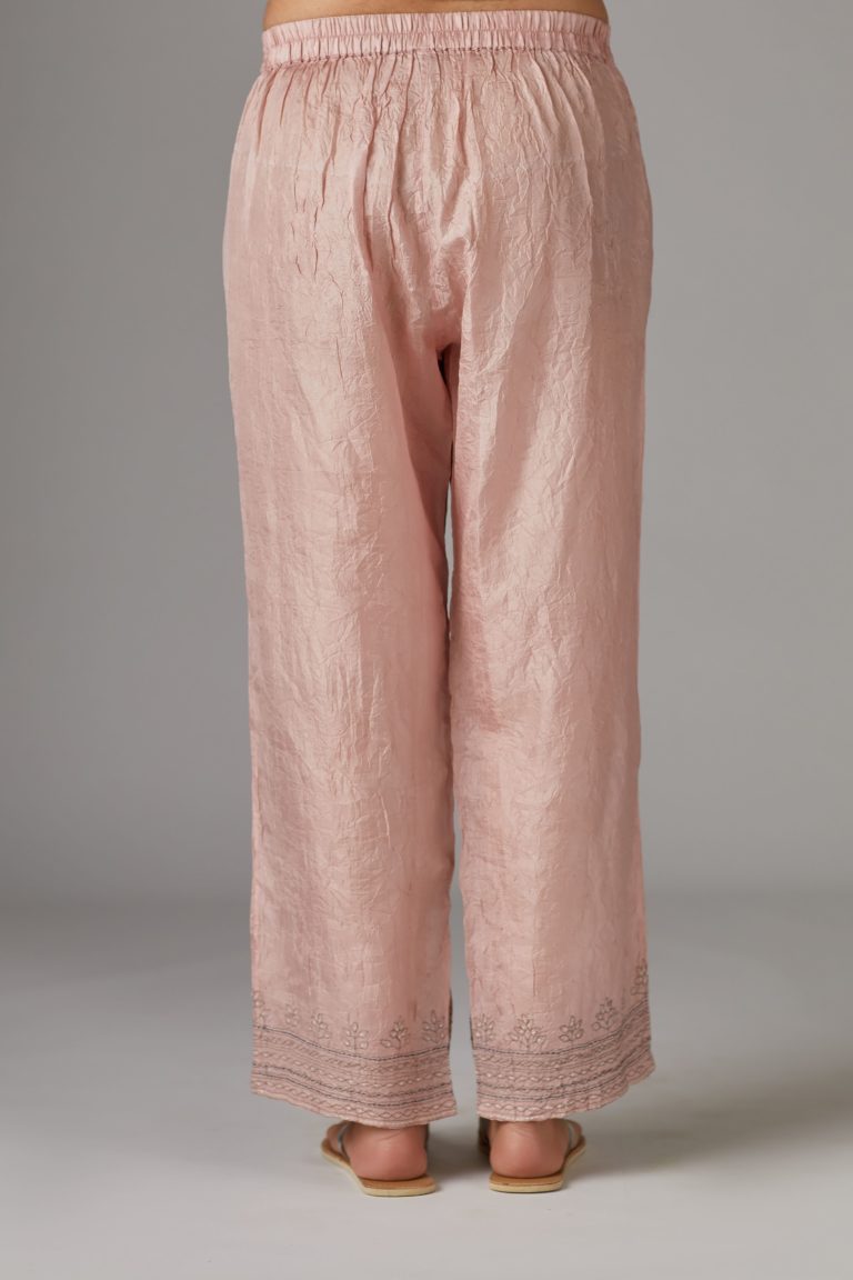 Pink straight pant with quilted embroidery at bottom hem
