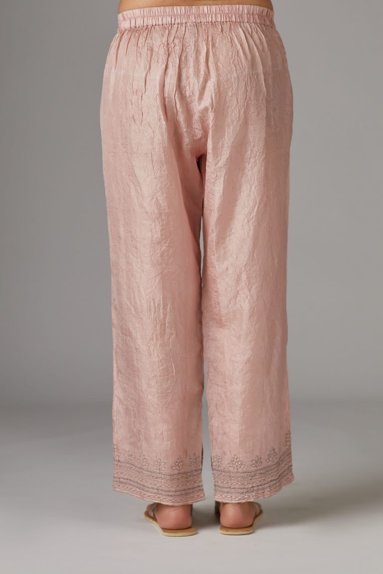 Pink straight pant with quilted embroidery at bottom hem