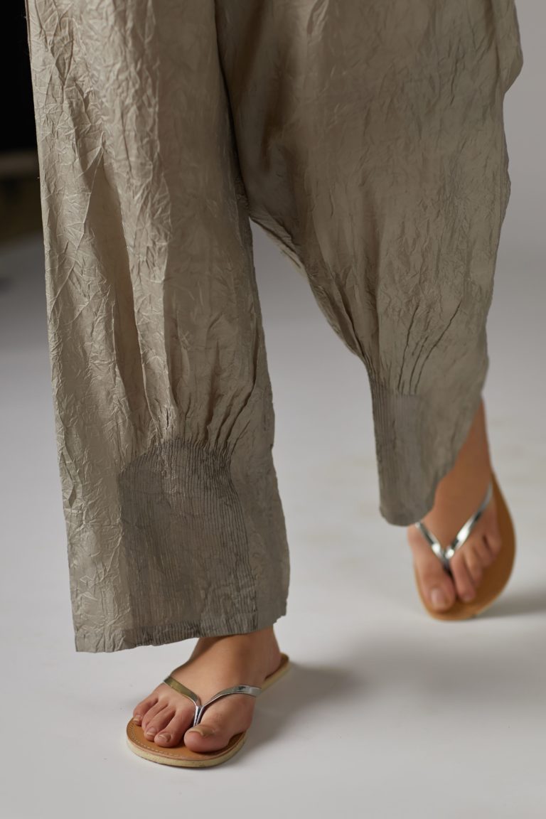 Grey straight crushed silk pants with pin tucks at hem
