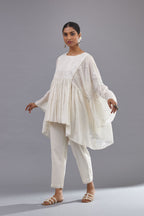 Off white cotton easy fit top with flared sleeves and hem, paired with off white cotton comfortable fit pant with all-over elasticated waistband.