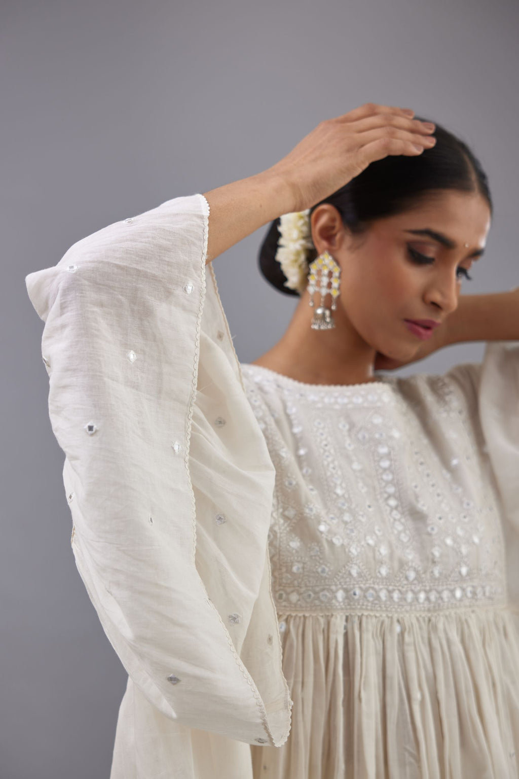 Off white cotton easy fit top with flared sleeves and hem, paired with off white cotton comfortable fit pant with all-over elasticated waistband.