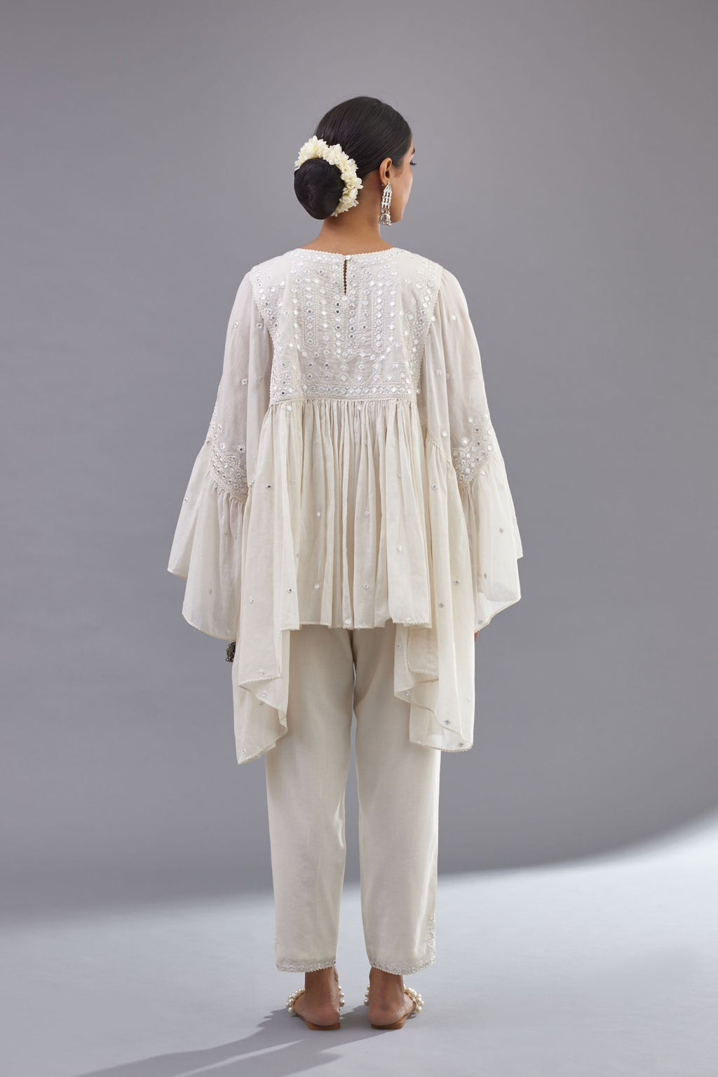 Off white cotton easy fit top with flared sleeves and hem, paired with off white cotton comfortable fit pant with all-over elasticated waistband.