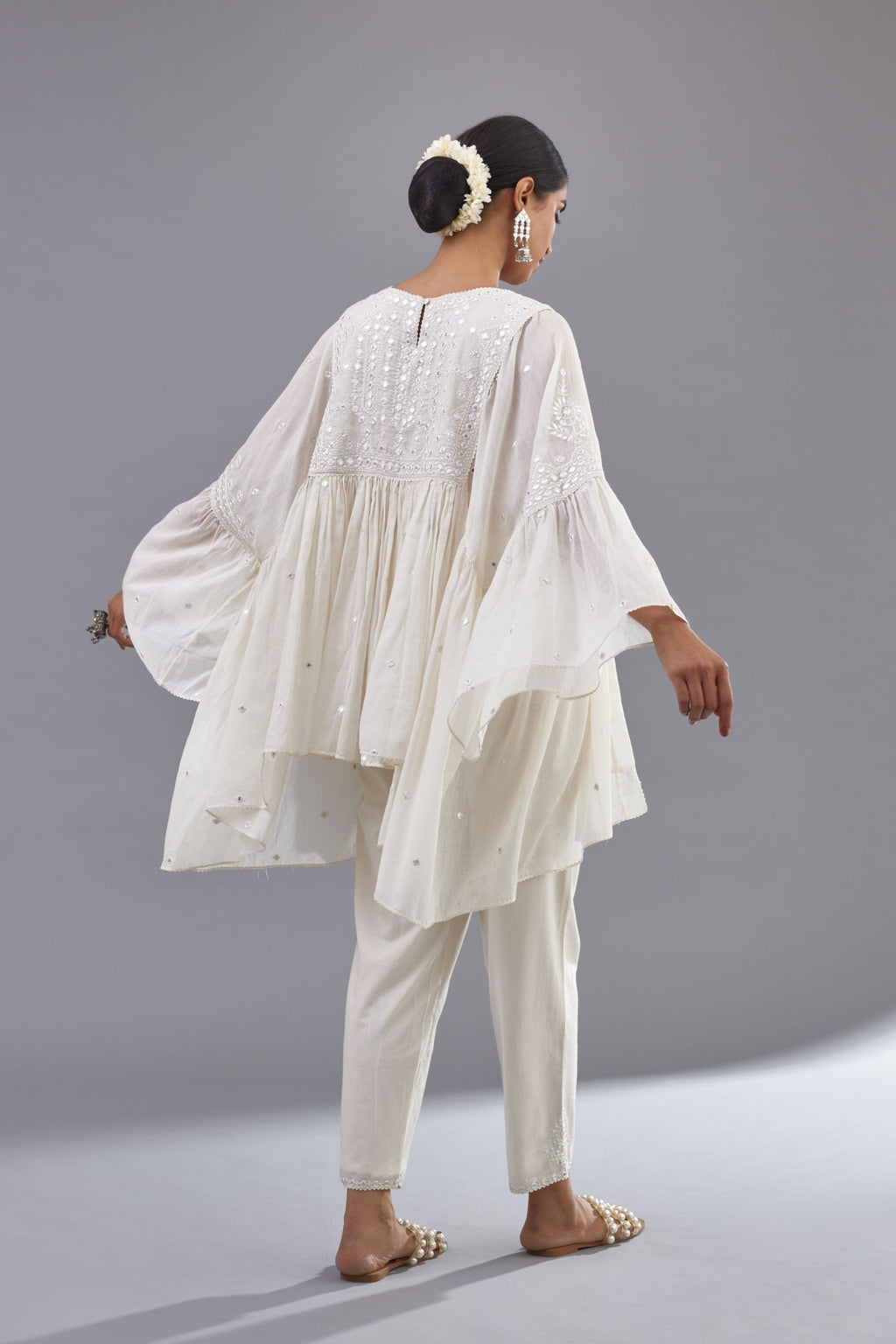 Off white cotton easy fit top with flared sleeves and hem, paired with off white cotton comfortable fit pant with all-over elasticated waistband.