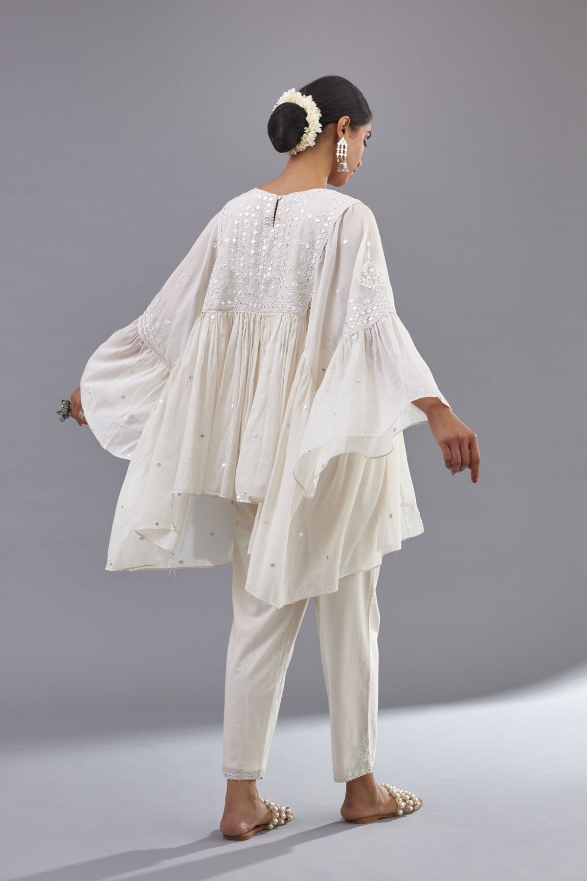 Off white cotton easy fit top with flared sleeves and hem, paired with off white cotton comfortable fit pant with all-over elasticated waistband.