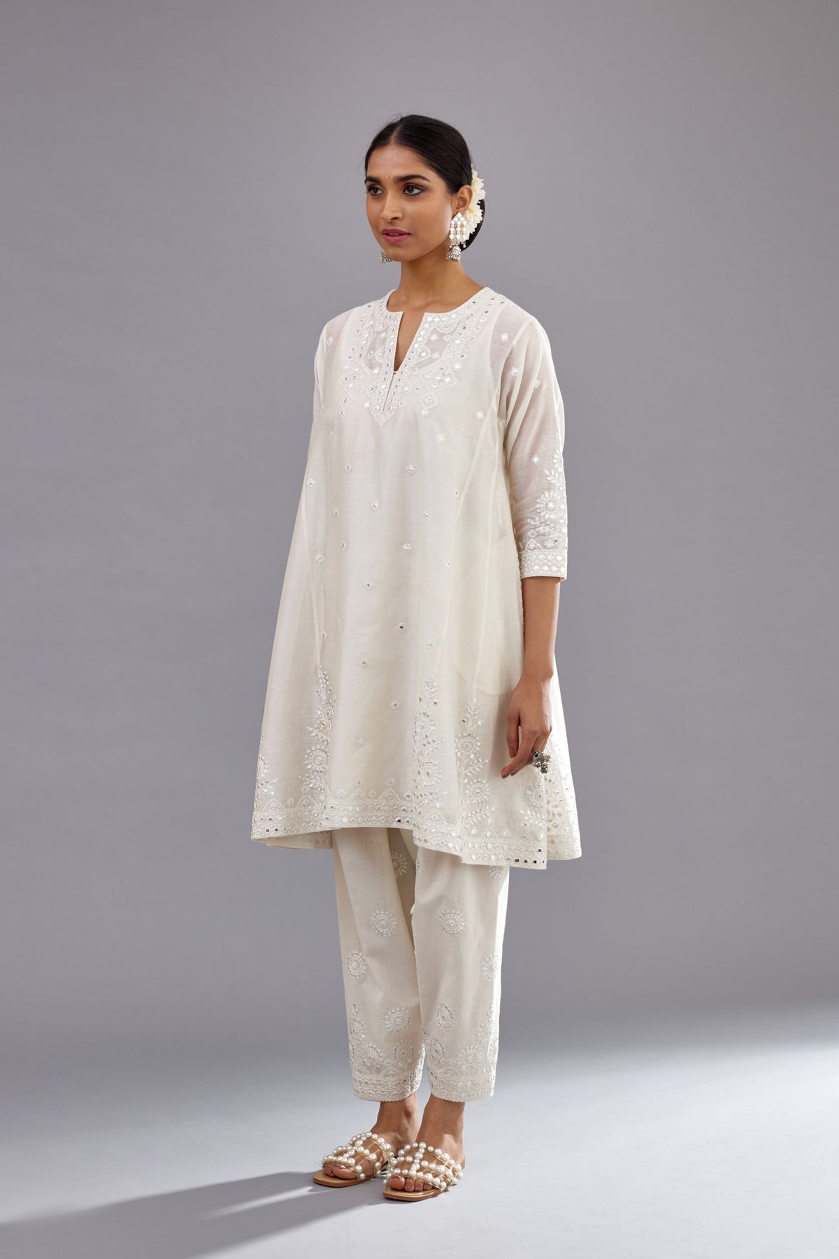 Off white silk Chanderi short panelled kurta set with off-white thread and mirror embroidery.