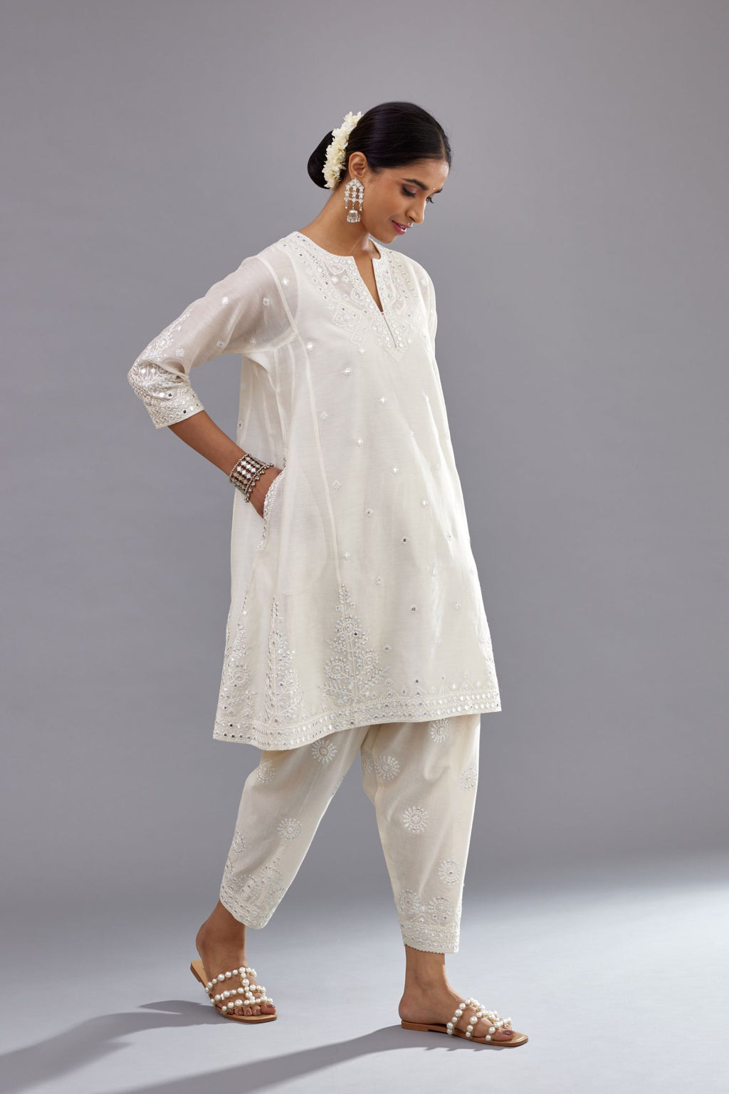 Off white silk Chanderi short panelled kurta set with off-white thread and mirror embroidery.
