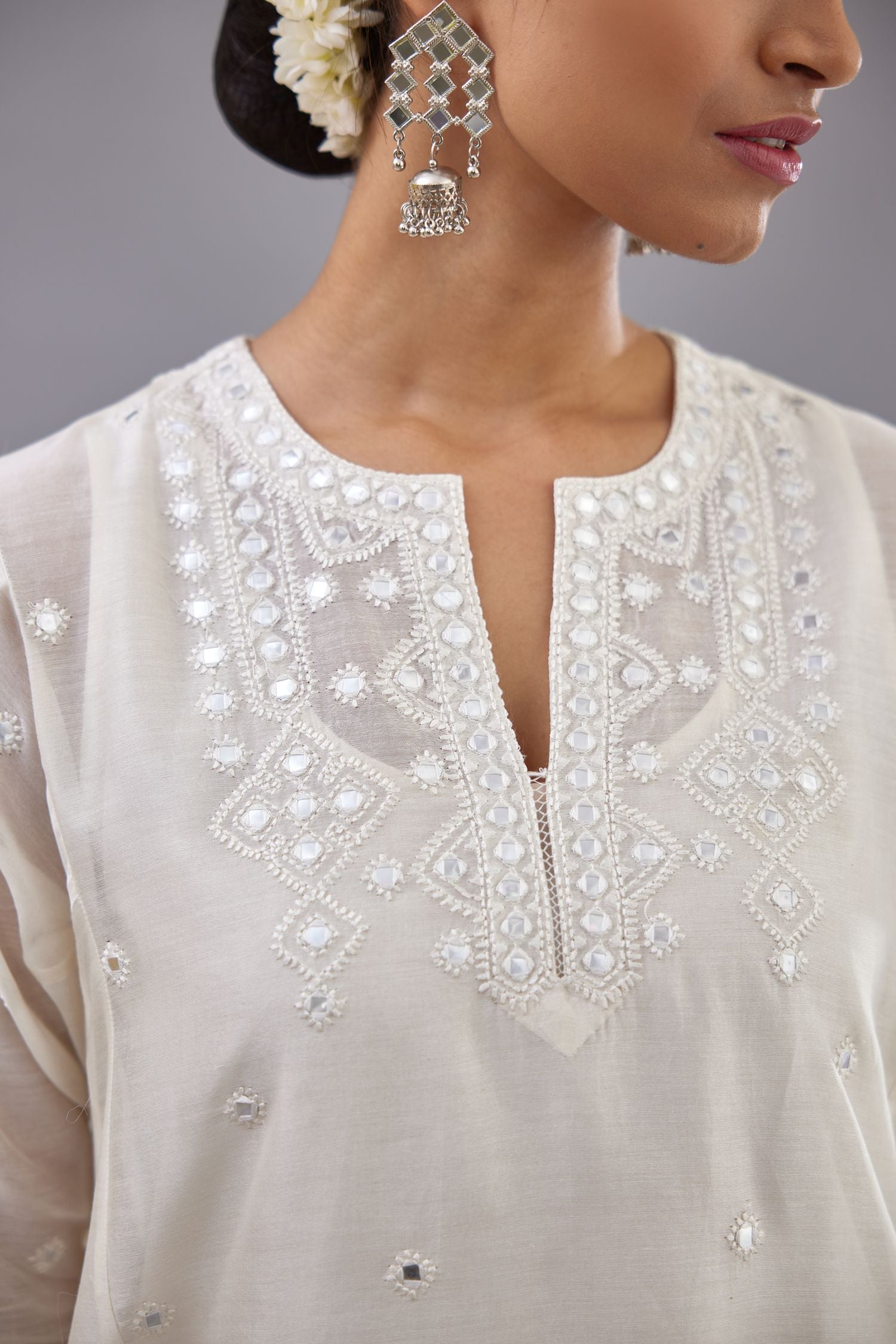 Off white silk Chanderi short panelled kurta set with off-white thread and mirror embroidery.