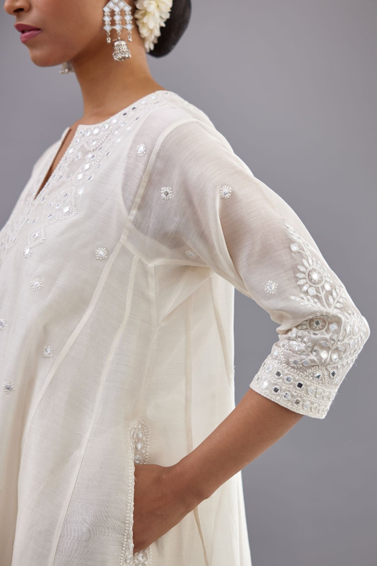 Off white silk Chanderi short panelled kurta set with off-white thread and mirror embroidery.