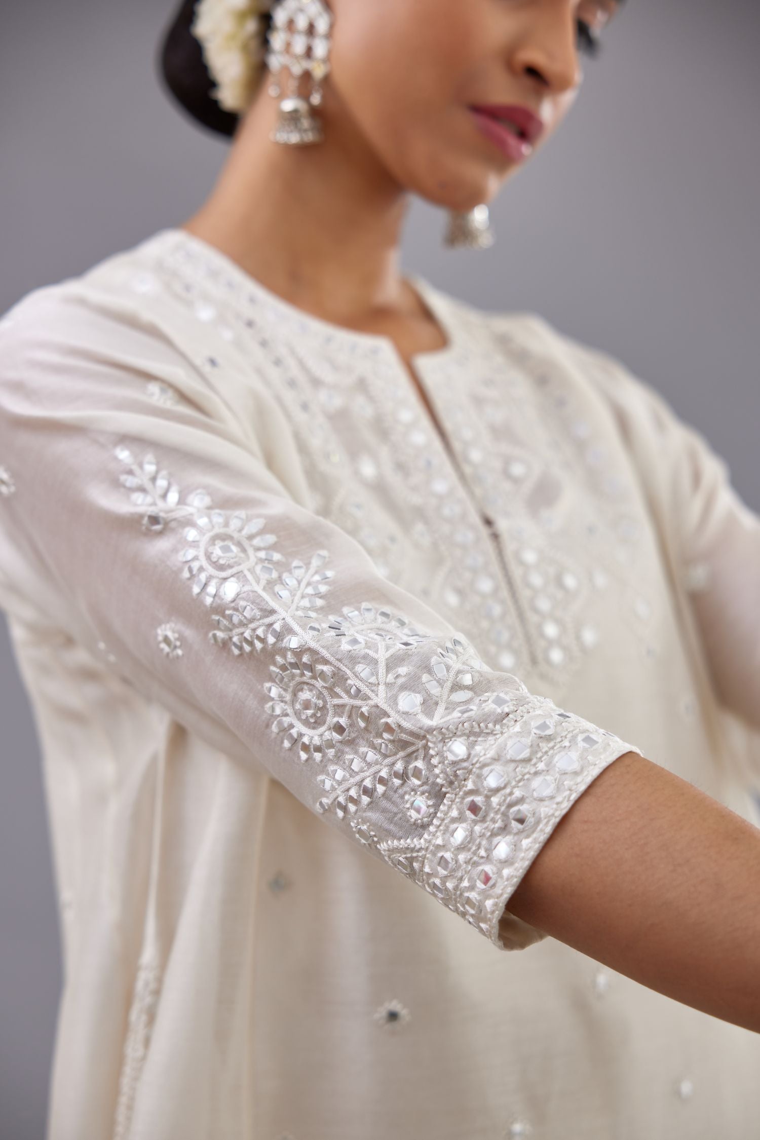 Off white silk Chanderi short panelled kurta set with off-white thread and mirror embroidery.