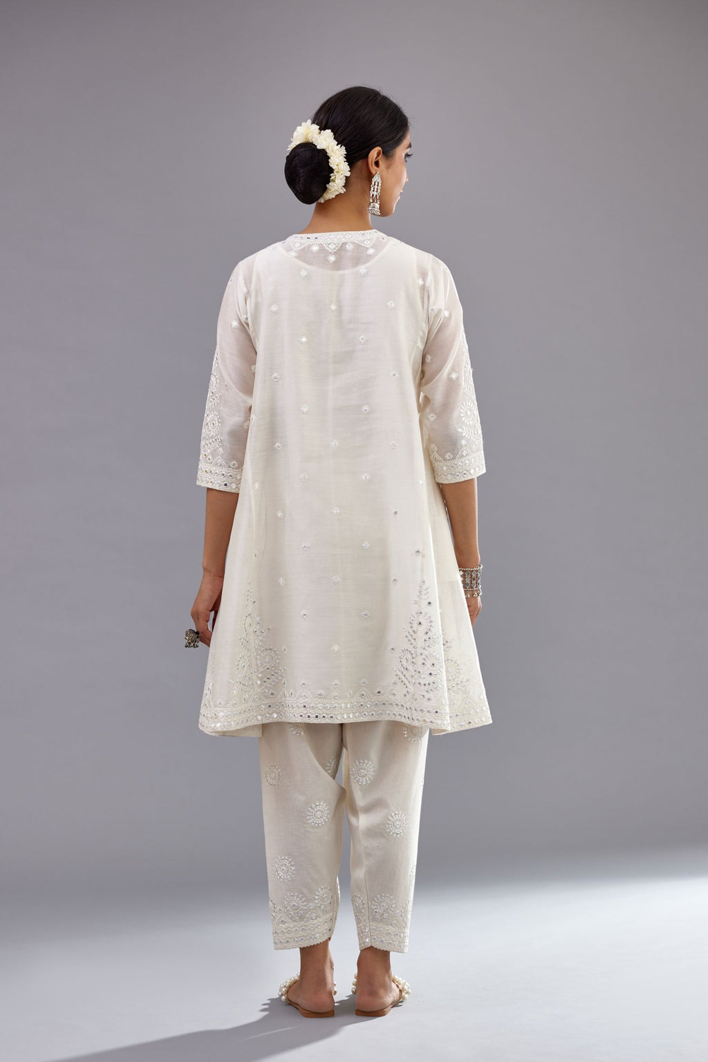 Off white silk Chanderi short panelled kurta set with off-white thread and mirror embroidery.