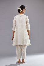 Off white silk Chanderi short panelled kurta set with off-white thread and mirror embroidery.