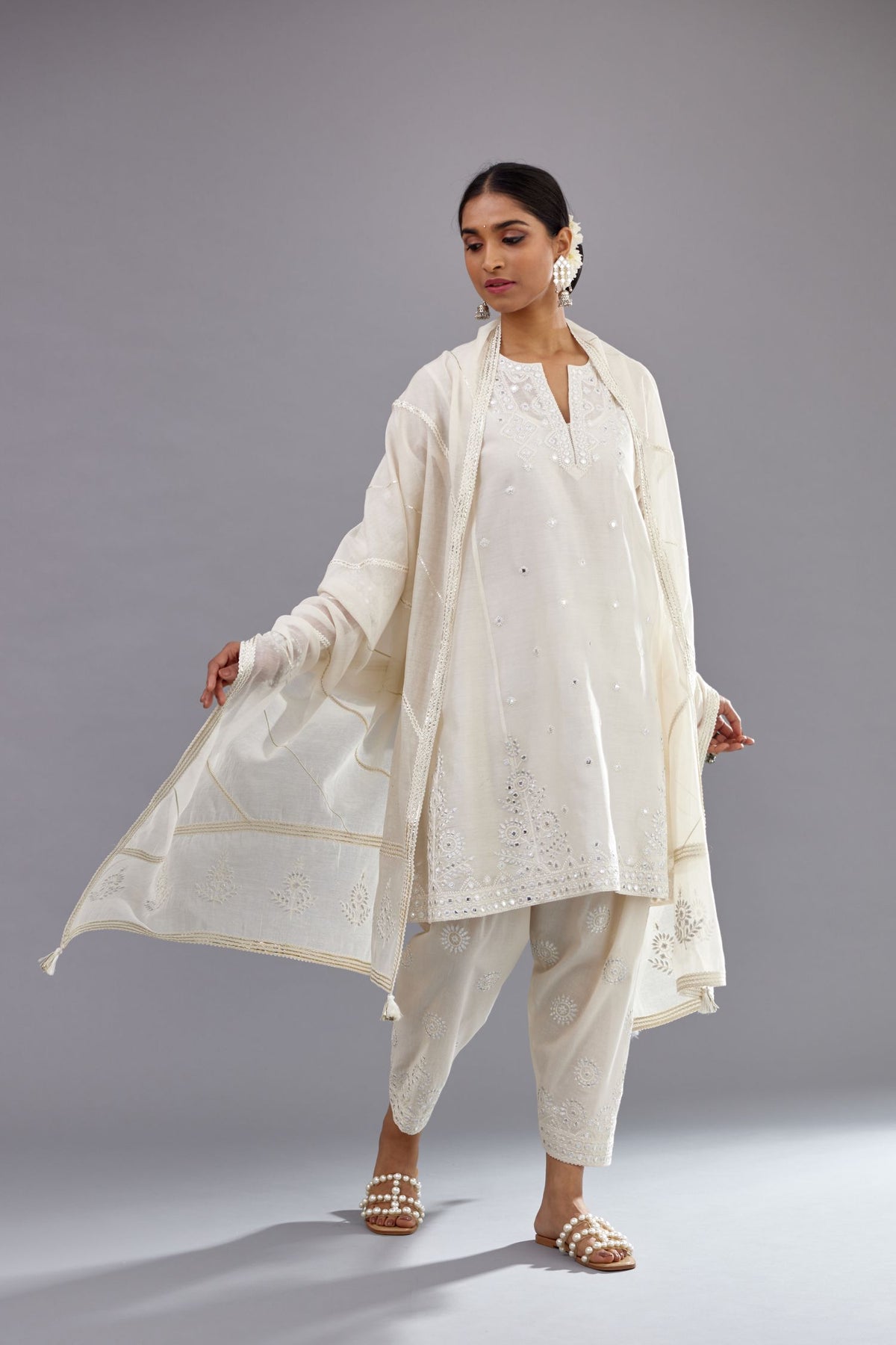 Off white silk Chanderi short panelled kurta set with off-white thread and mirror embroidery.