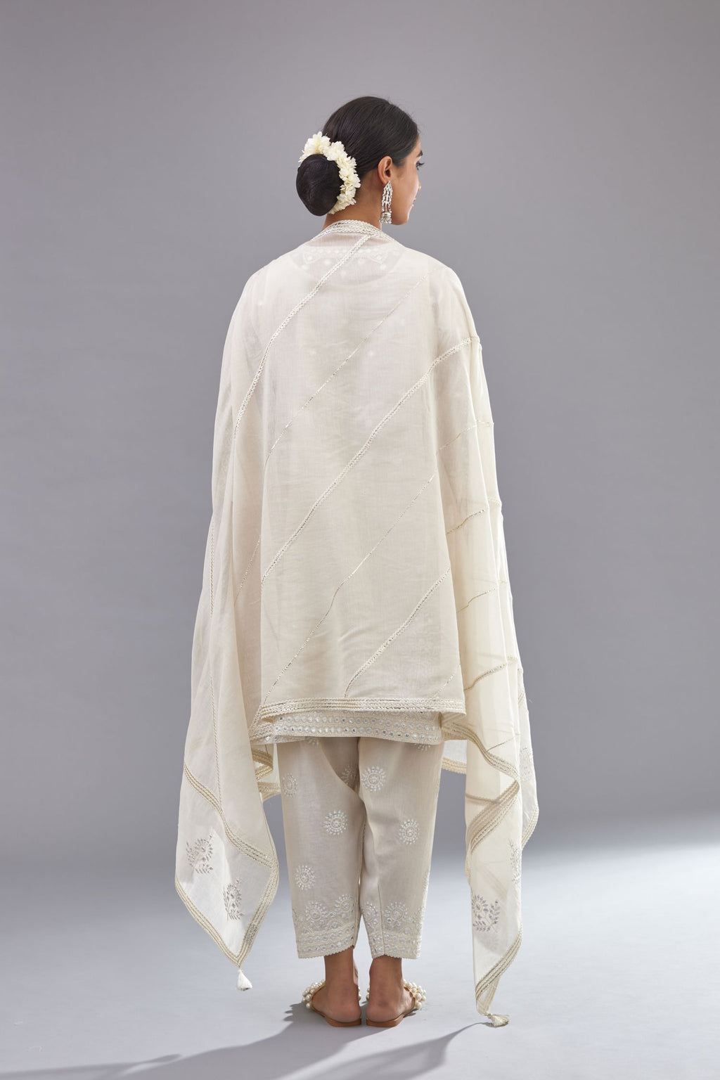 Off white silk Chanderi short panelled kurta set with off-white thread and mirror embroidery.