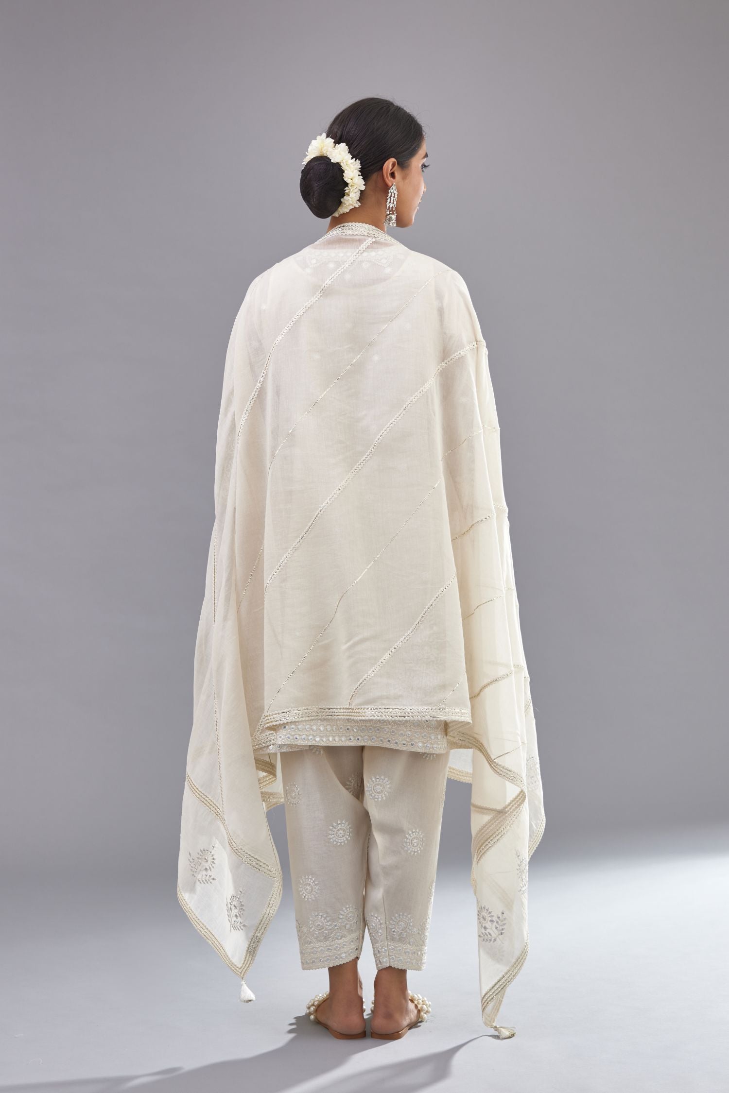 Off white silk Chanderi short panelled kurta set with off-white thread and mirror embroidery.