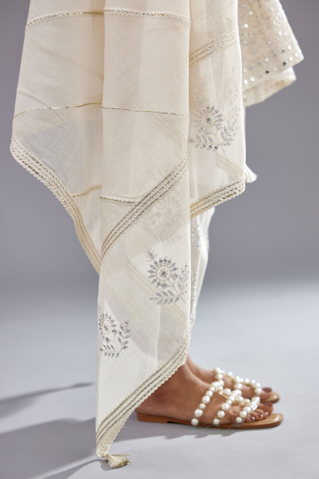 Off white silk Chanderi short panelled kurta set with off-white thread and mirror embroidery.