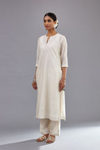 Off white silk Chanderi straight long kurta set with round neck, highlighted with off-white thread and mirror embroidery.
