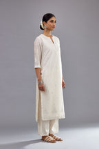 Off white silk Chanderi straight long kurta set with round neck, highlighted with off-white thread and mirror embroidery.
