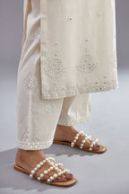 Off white silk Chanderi straight long kurta set with round neck, highlighted with off-white thread and mirror embroidery.