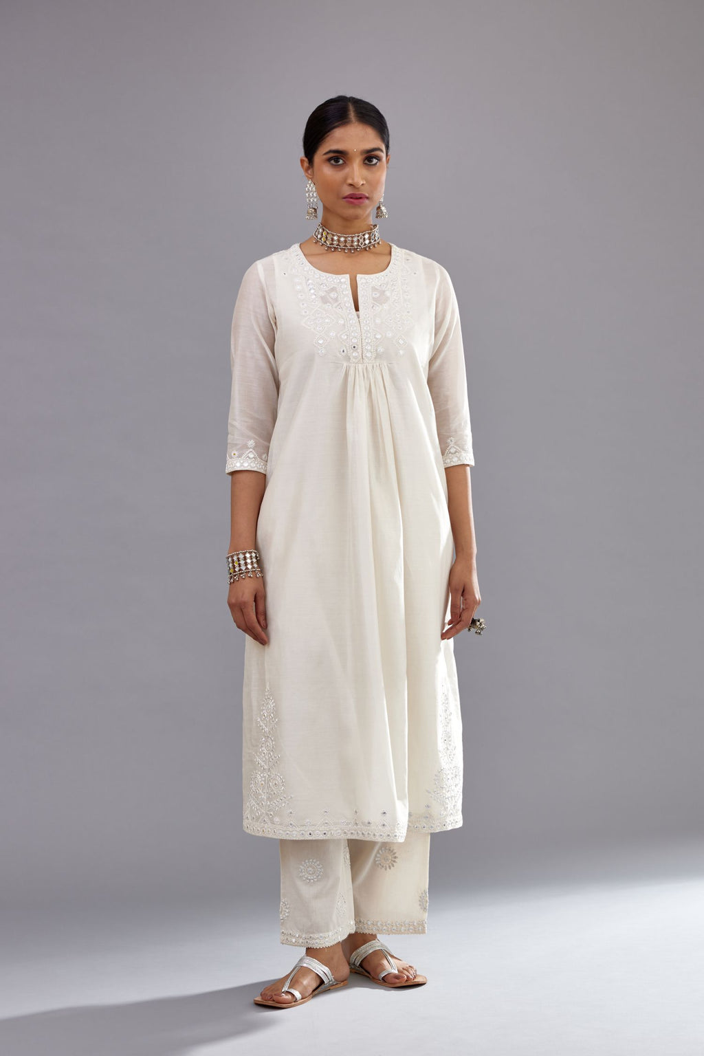 Off white silk Chanderi straight long kurta dress set with off-white thread and mirror embroidery.