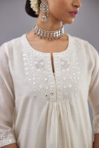 Off white silk Chanderi straight long kurta dress set with off-white thread and mirror embroidery.