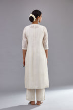 Off white silk Chanderi straight long kurta dress set with off-white thread and mirror embroidery.