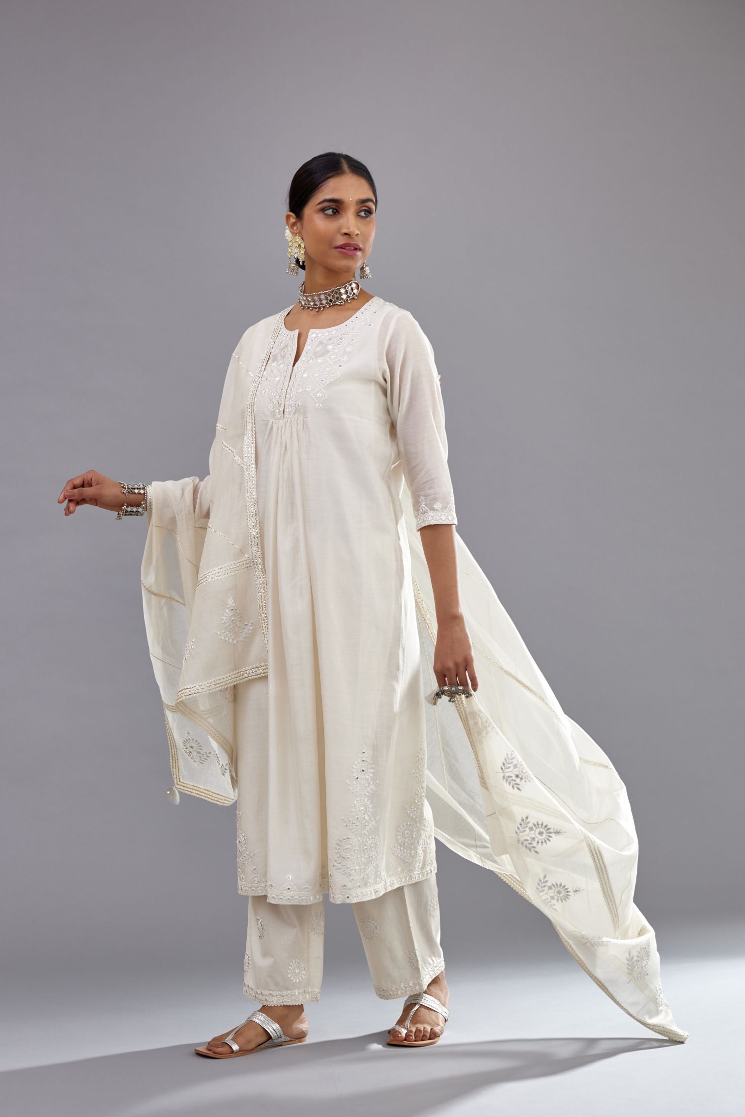 Off white silk Chanderi straight long kurta dress set with off-white thread and mirror embroidery.