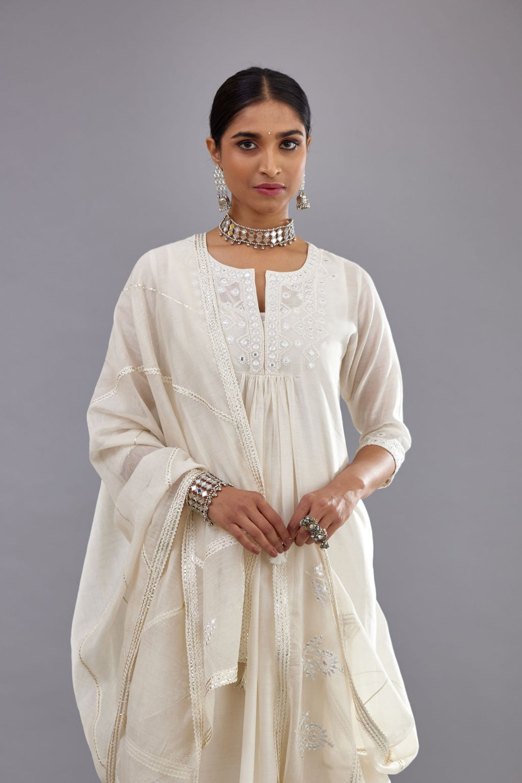 Off white silk Chanderi straight long kurta dress set with off-white thread and mirror embroidery.