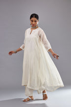 Off white Cotton Chanderi panelled and asymmetric hem long kurta set with off-white thread and mirror embroidery.