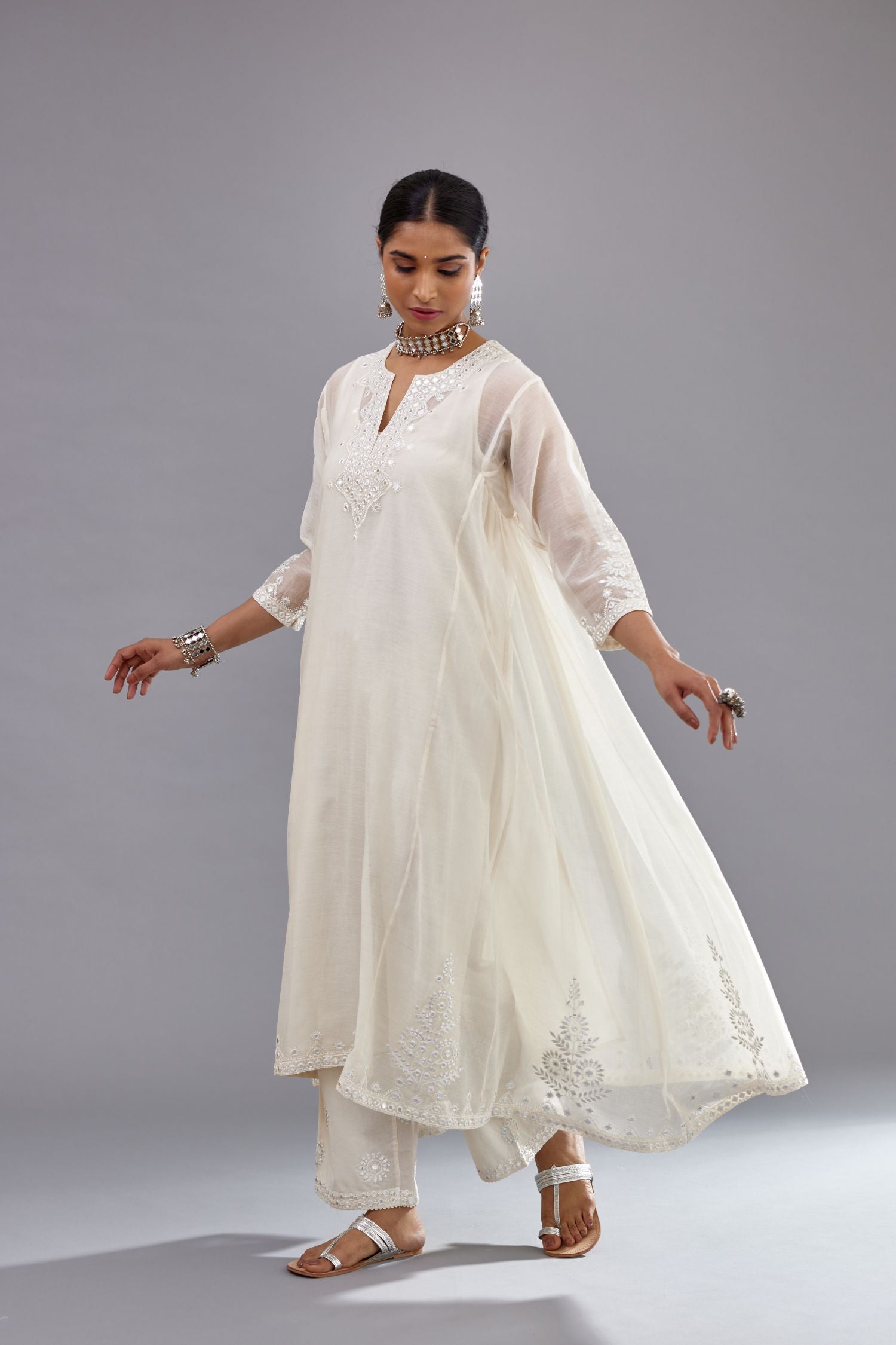 Off white Cotton Chanderi panelled and asymmetric hem long kurta set with off-white thread and mirror embroidery.