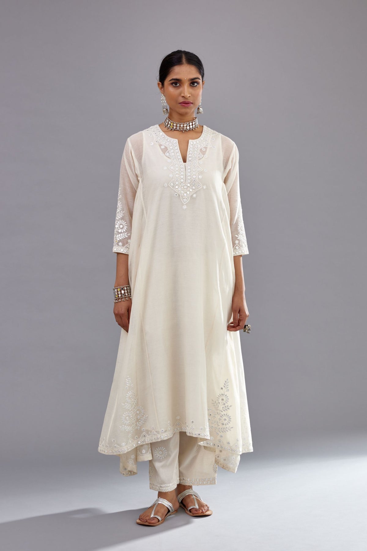 Off white Cotton Chanderi panelled and asymmetric hem long kurta set with off-white thread and mirror embroidery.